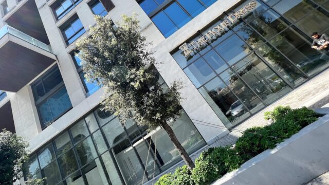 a tree in front of a building