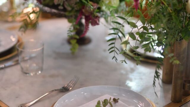 a table with a plate and napkin on it