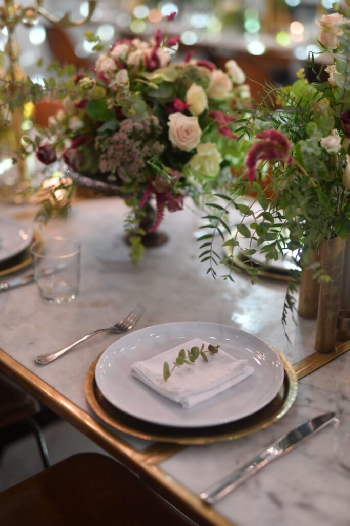 a table with a plate and napkin on it