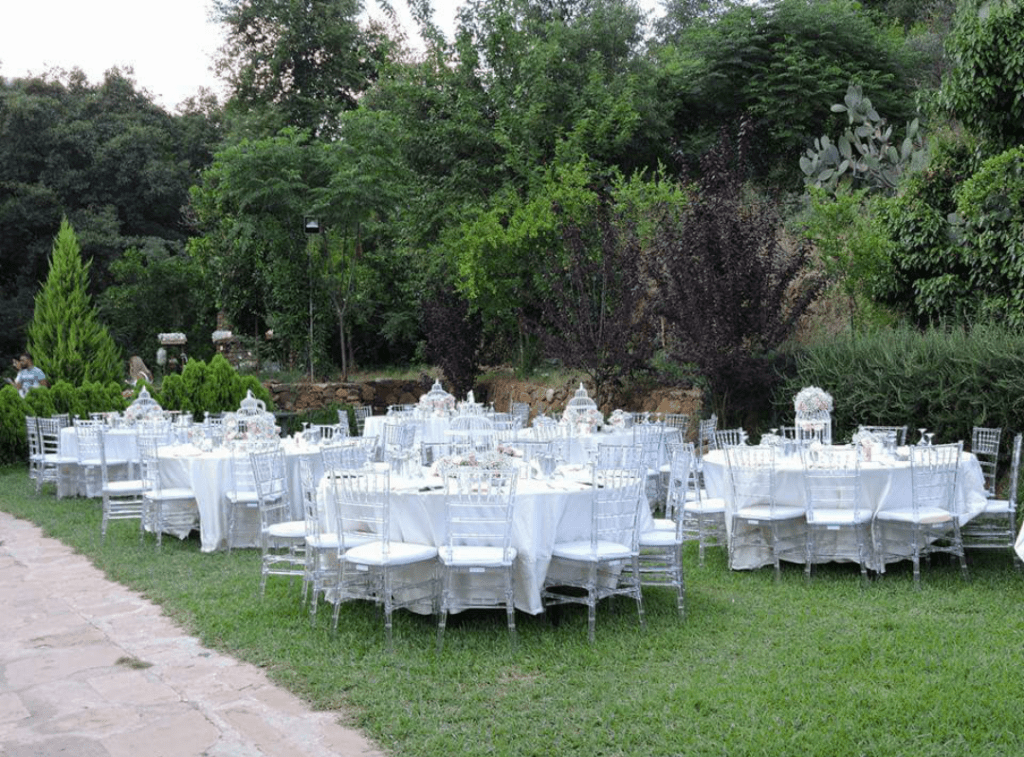 a group of tables set up in a garden