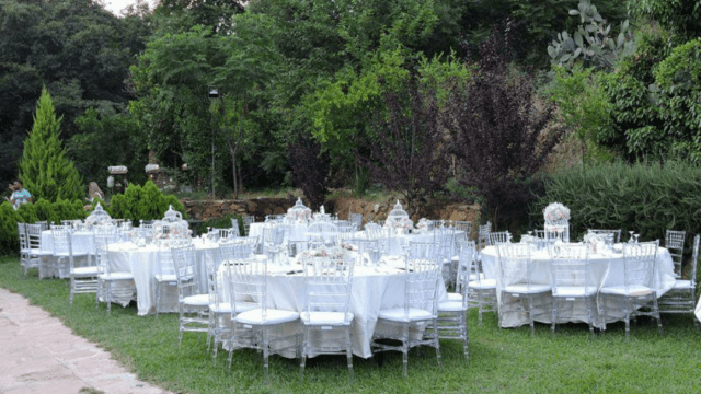 a group of tables set up in a garden