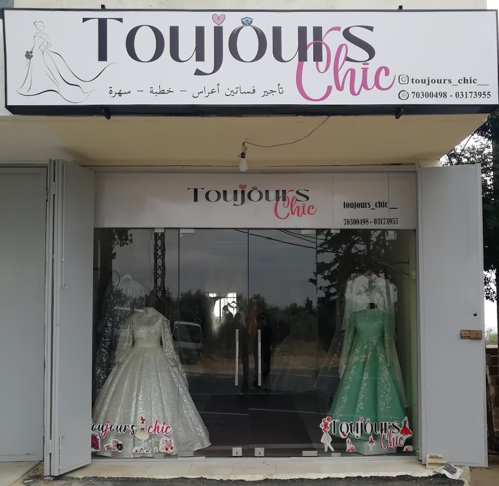a store front with dresses in it