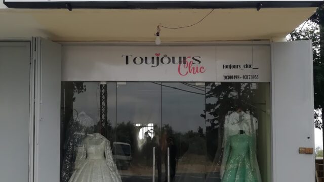 a store front with dresses in it