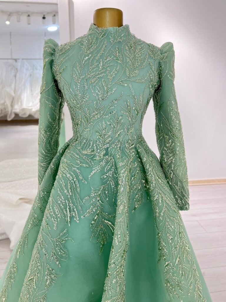 a green dress with gold sequins