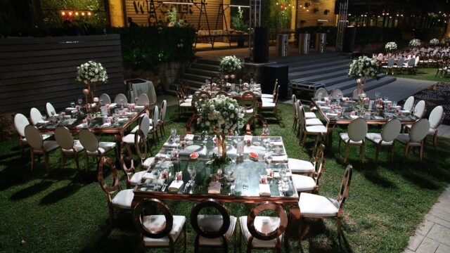 a group of tables set up in a yard