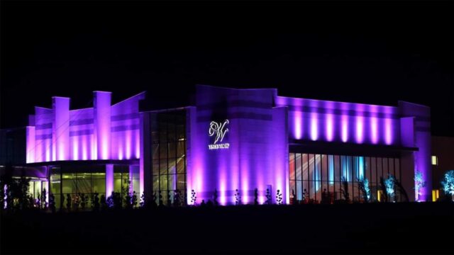 a building with purple lights at night