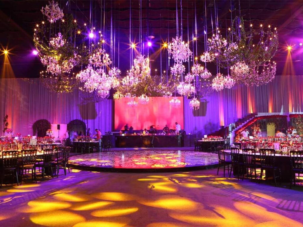 a room with chandeliers and tables
