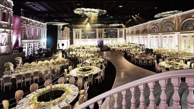 a large ballroom with tables and chairs