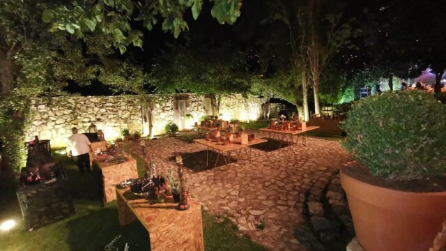 a group of tables and chairs in a courtyard