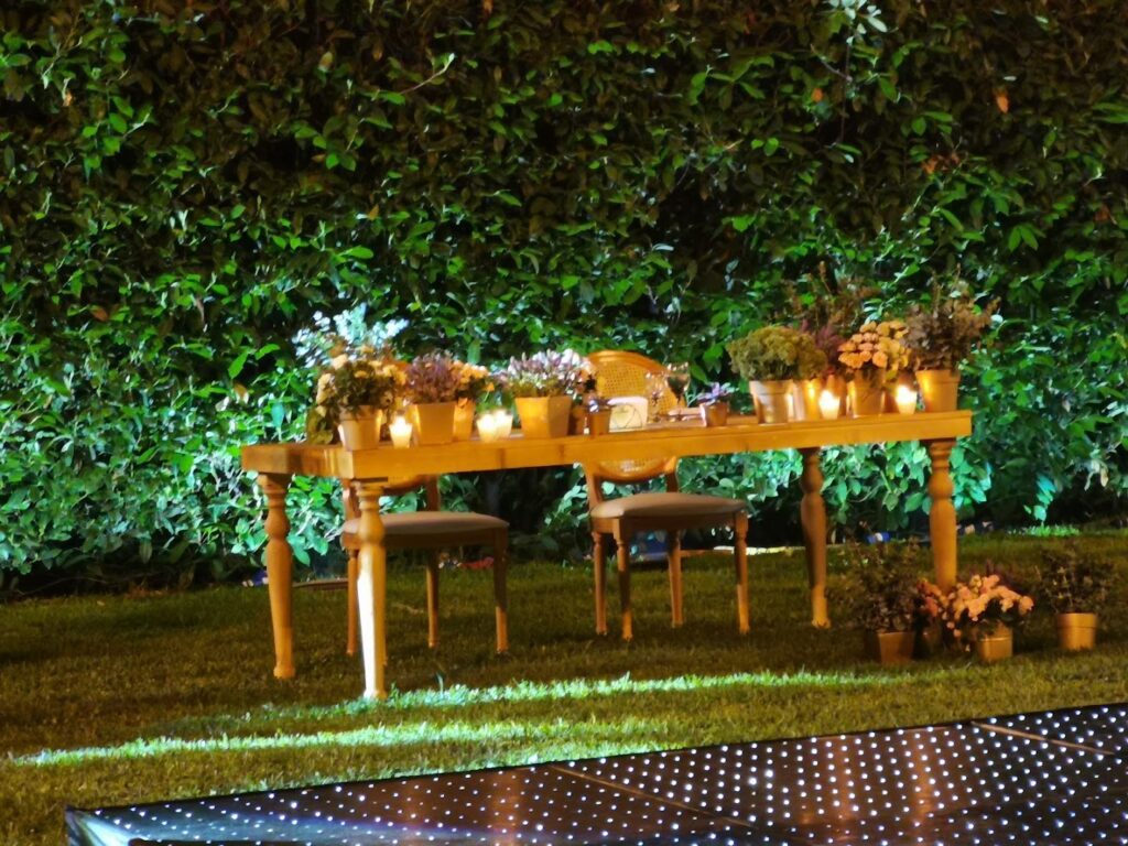 a table with flowers and candles on it