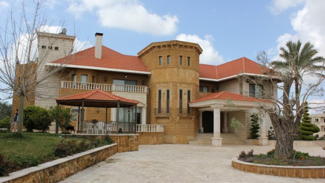 a large house with a stone patio
