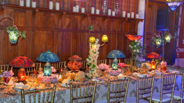 a table set with flowers and candles