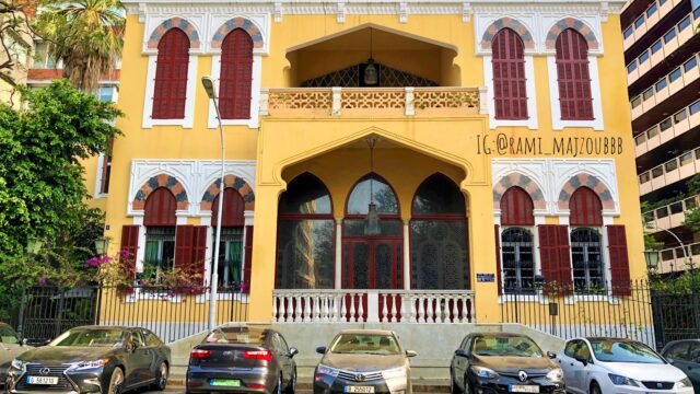 a building with cars parked in front of it