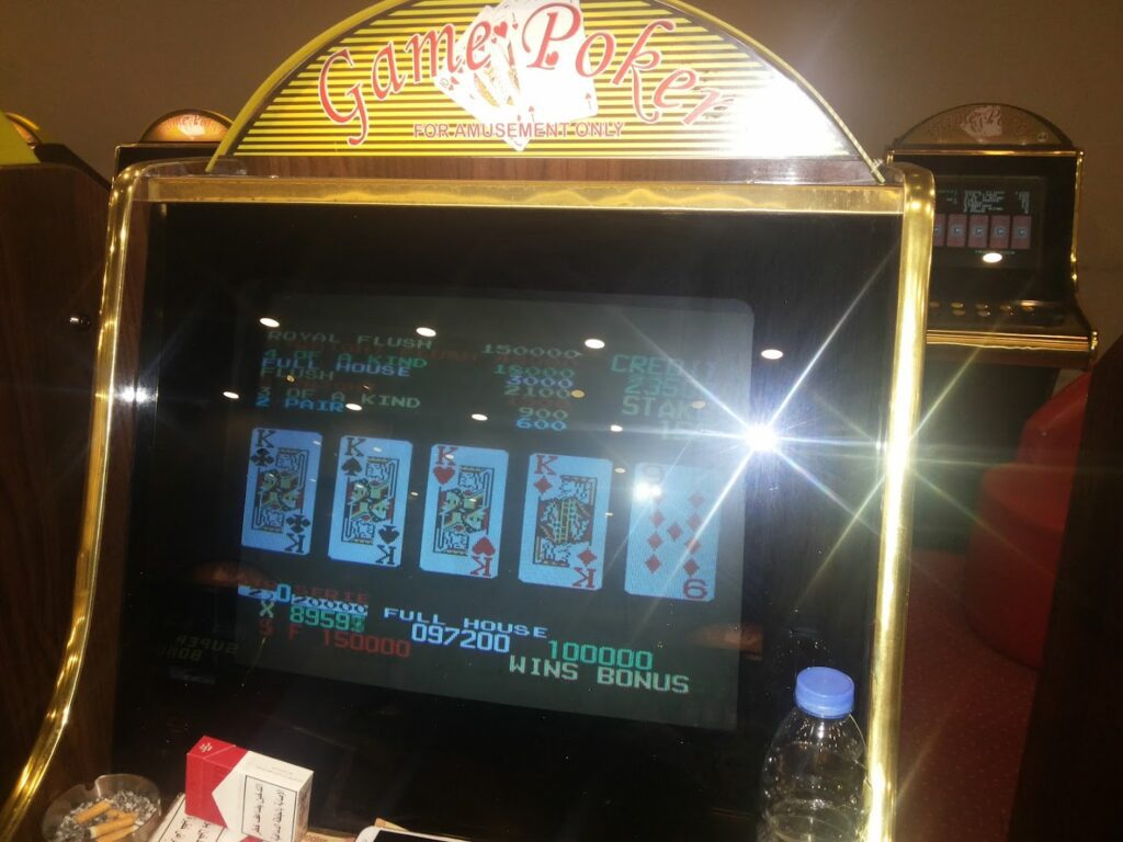 a machine with cards and a bottle of water