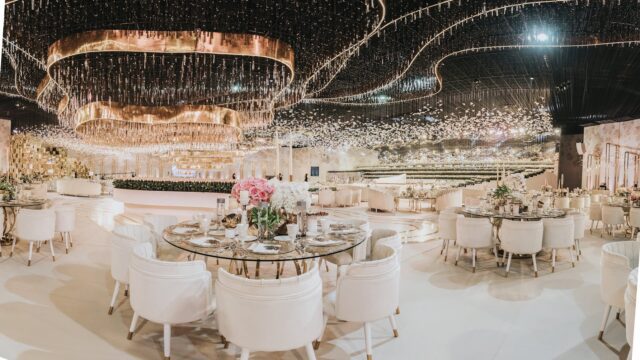 a room with a round table and chairs