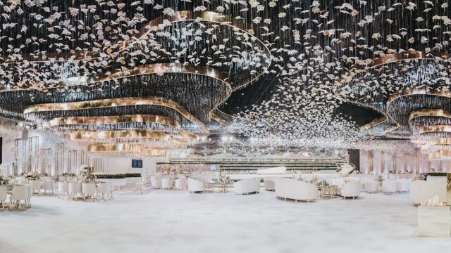 a room with white furniture and white chairs