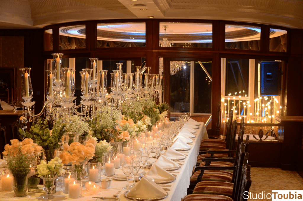 a table with candles and flowers