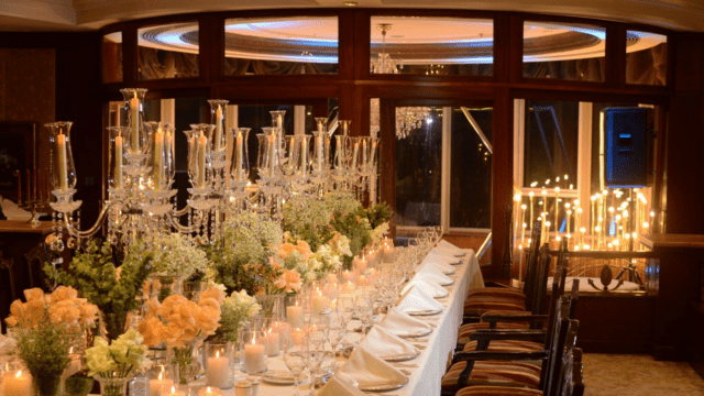 a table with candles and flowers