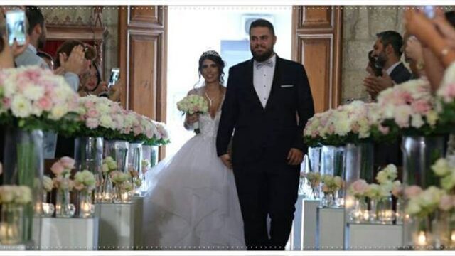 a man and woman walking down a aisle