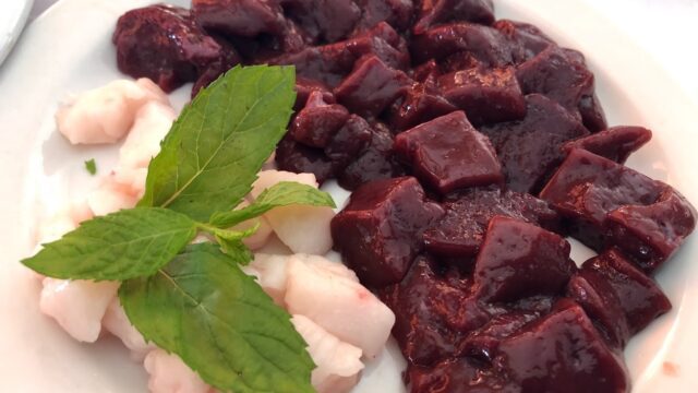 a plate of food with a leaf