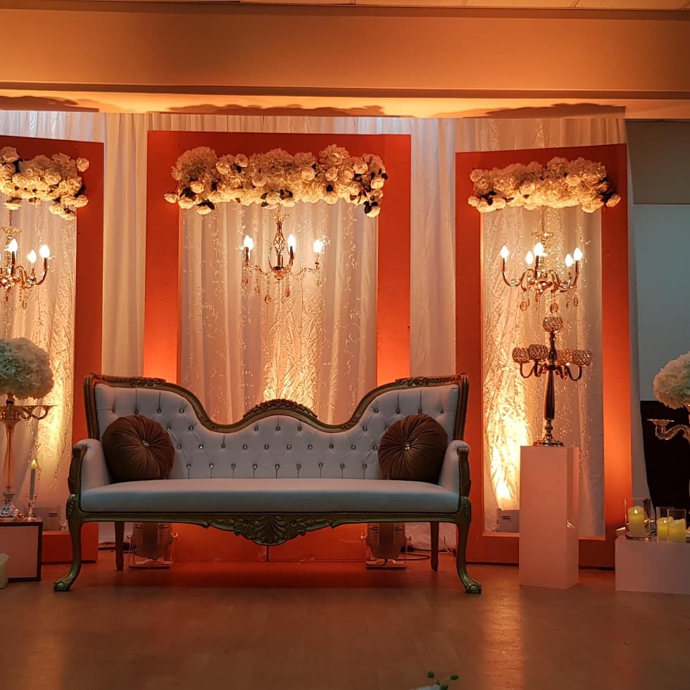 a couch and chandeliers in a room