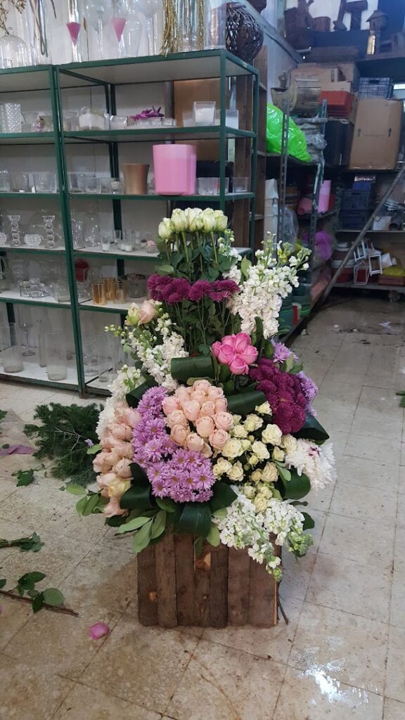 a large arrangement of flowers in a room