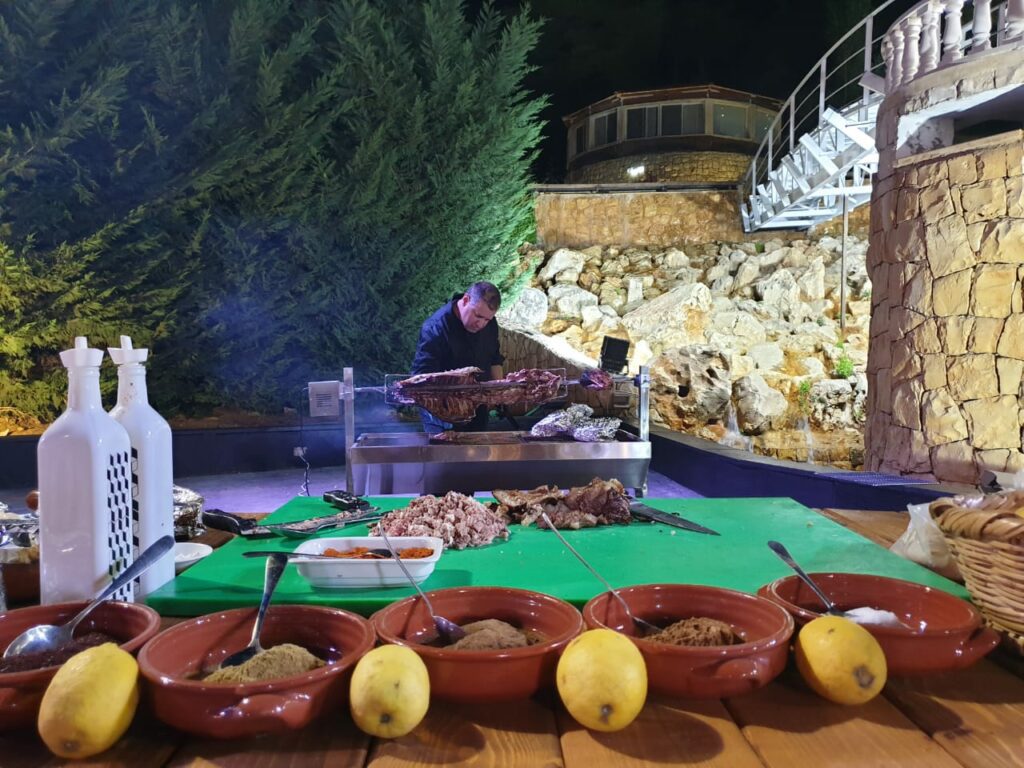 a man cooking food on a grill