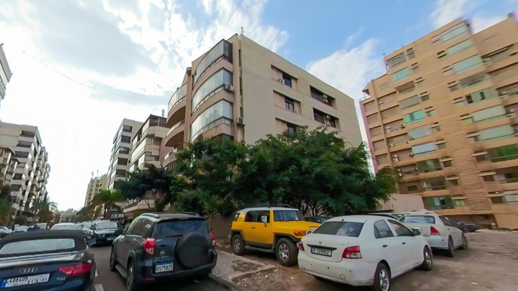 cars parked in front of a building