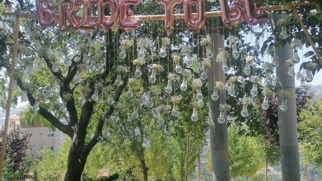 a sign with lights from a tree