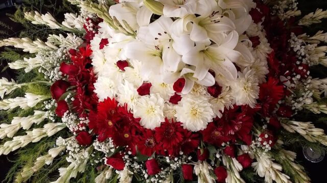 a bouquet of flowers on a black surface