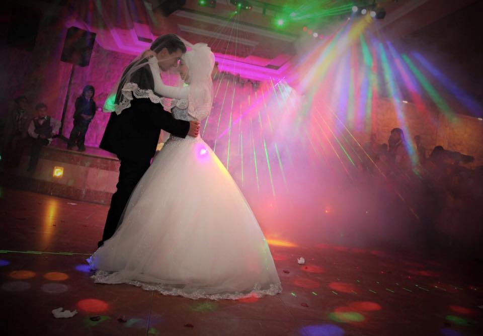 a man and woman dancing on a dance floor