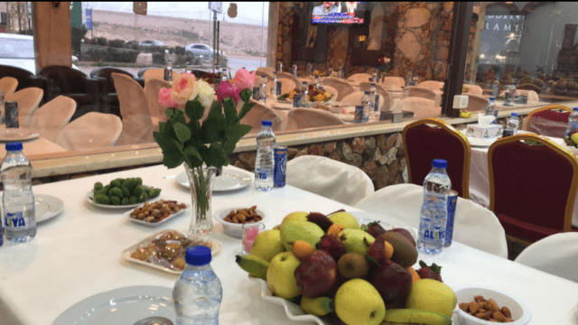 a table with fruit and water bottles