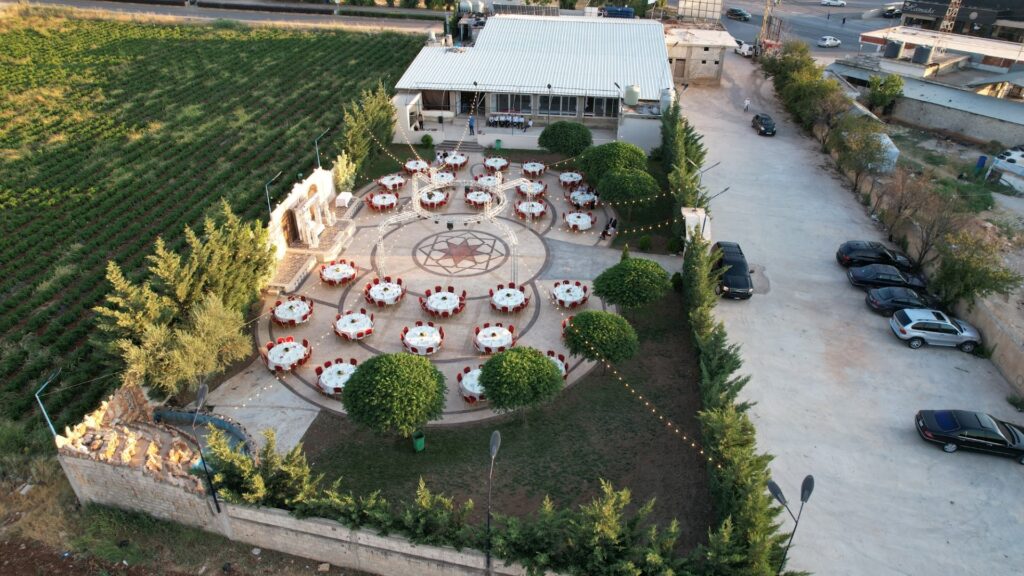 a aerial view of a courtyard with tables and chairs