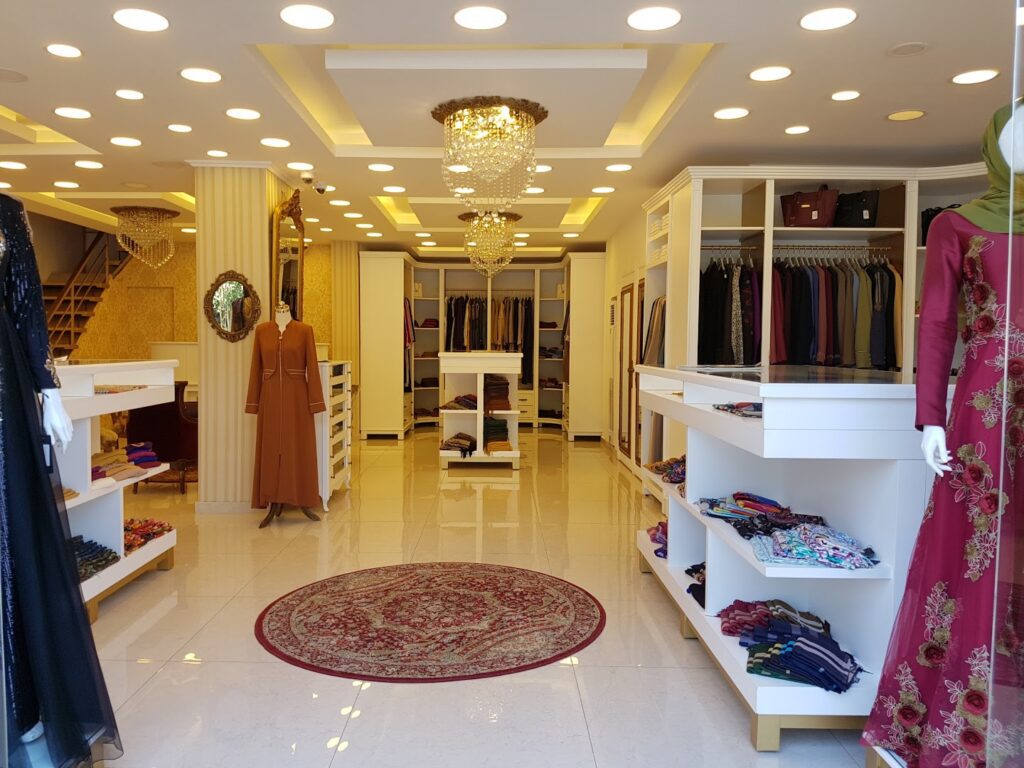 a store with a chandelier and shelves