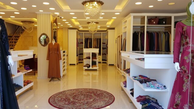 a store with a chandelier and shelves