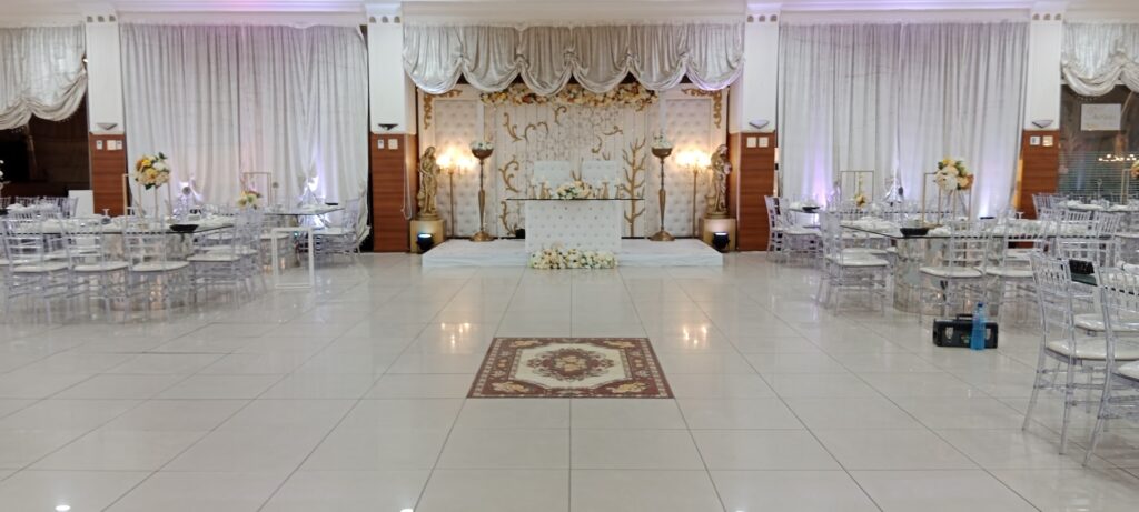 A white room with a white table and chairs at Al-Nojoom Wedding Center 💫since 2008 💫1st branch Kabershmoun 💫2nd branch Queens plaza Bouchryieh.