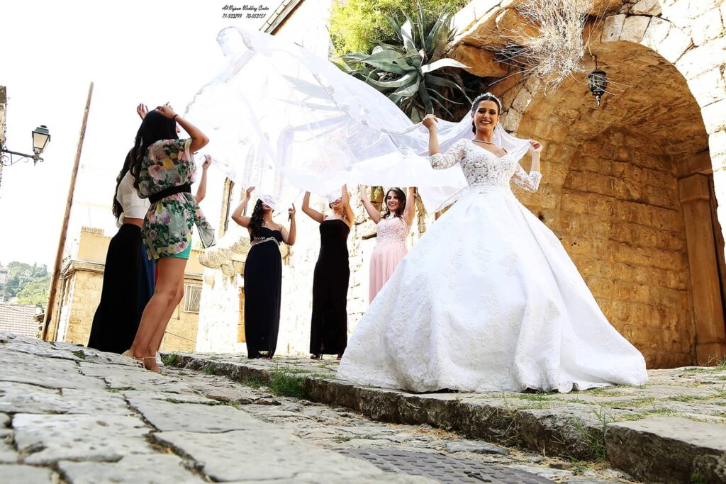 A group of women in a wedding dress, showcasing their elegance and charm at Al-Nojoom_Wedding_Center 💫since 2008 💫1st branch kabershmoun 💫2nd branch Queens plaza bouchryieh.