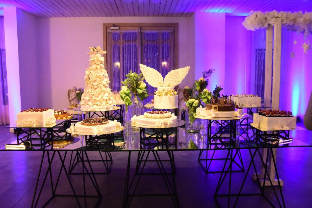 A table with food on it, catered by Bluemz Catering.