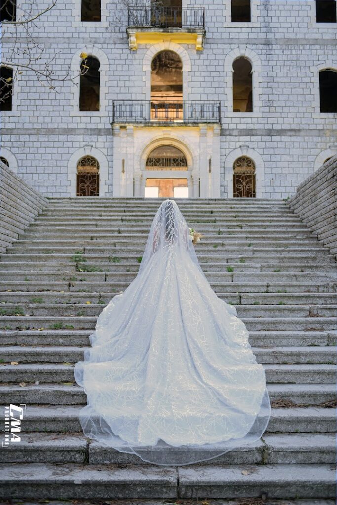 a woman in a wedding dress on stairs