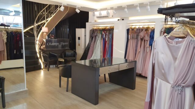 a room with a table and chairs and a piano