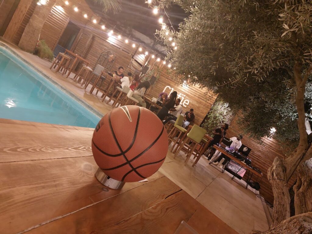 a basketball on a table near a pool
