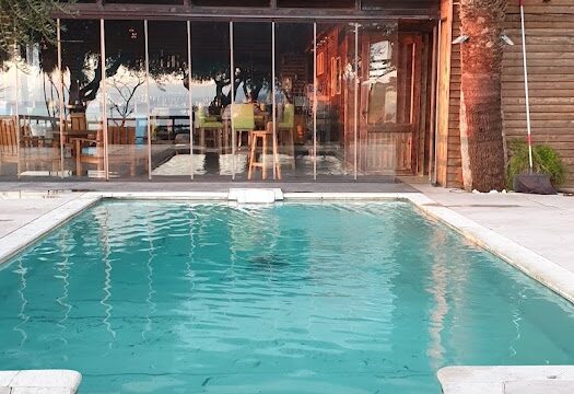 a pool in front of a building