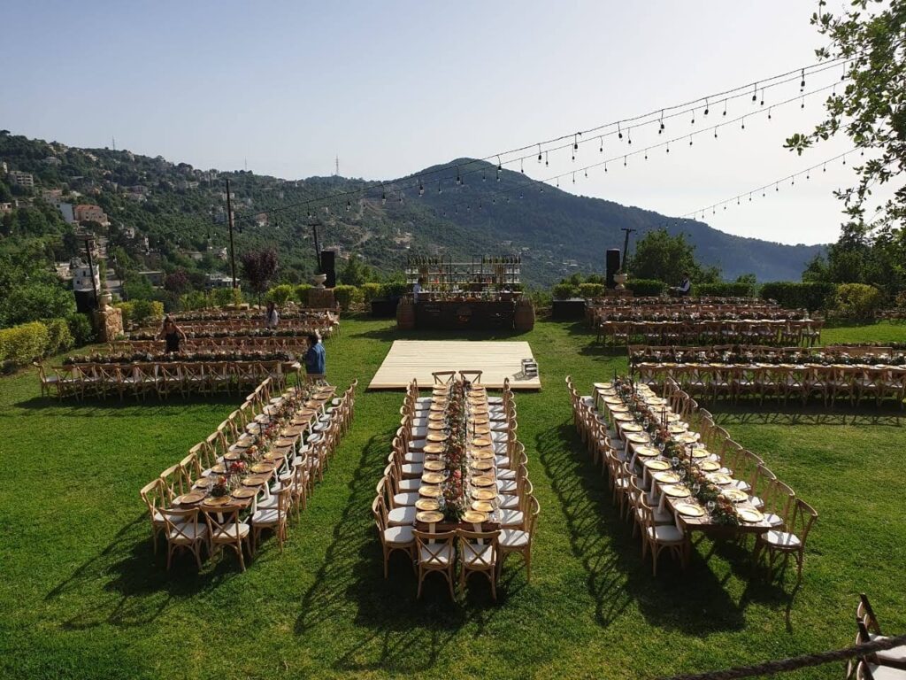a group of chairs and tables on a lawn