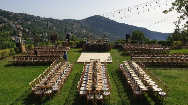 a group of chairs and tables on a lawn