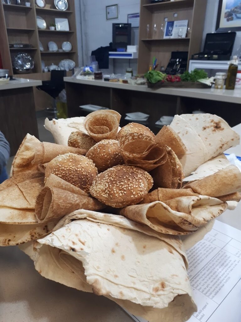 "Cuisine D'or Catering serves a delectable bowl of bread wrapped in their signature wrapper."