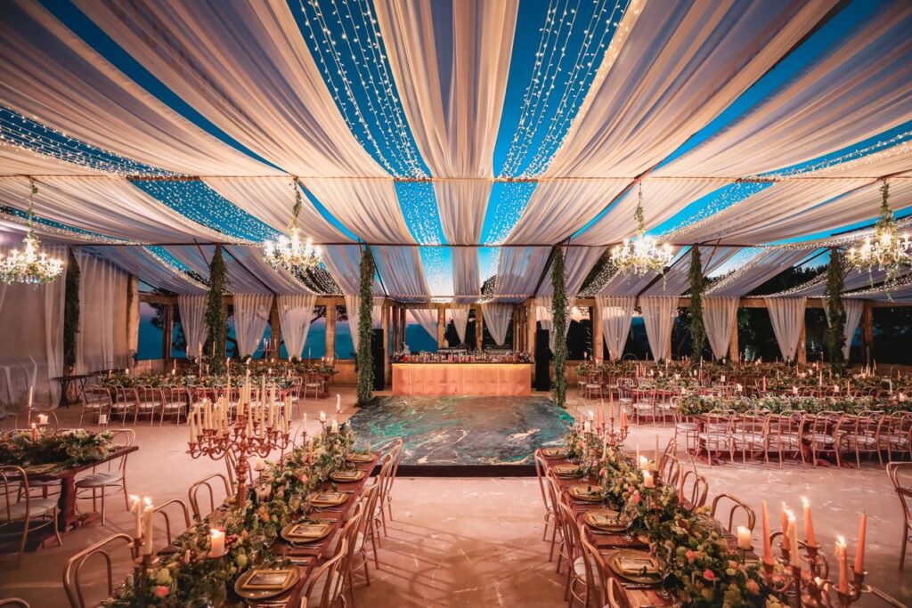 Dalia Catering offers a large indoor tent with tables and chairs.