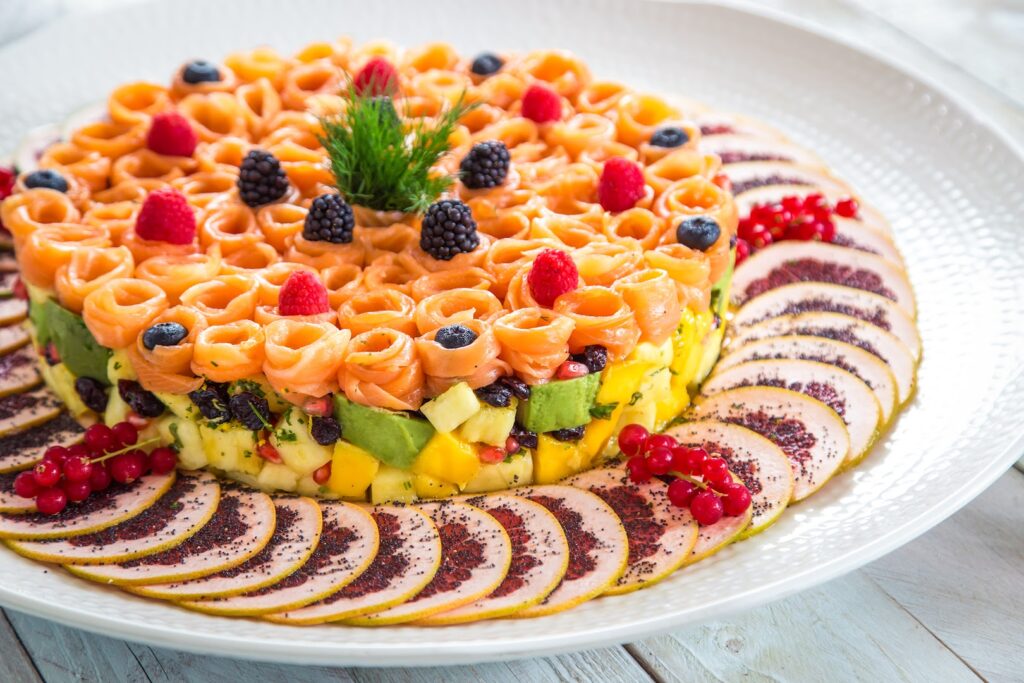 "A plate of food on a table catered by Dalia Catering."