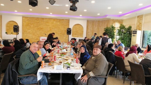 a group of people sitting at a table