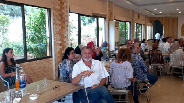 a group of people sitting at tables