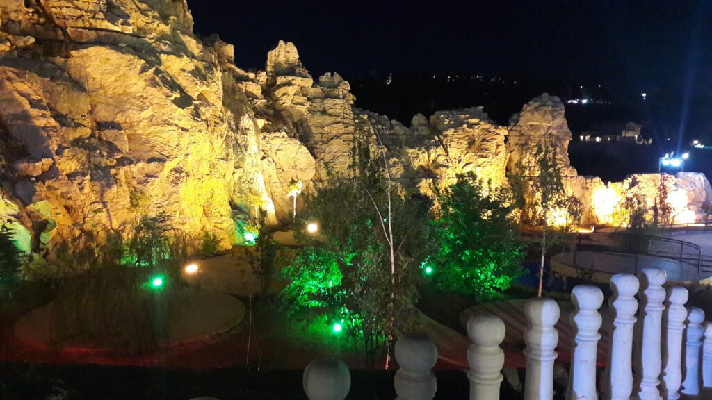 a rock formations with lights at night